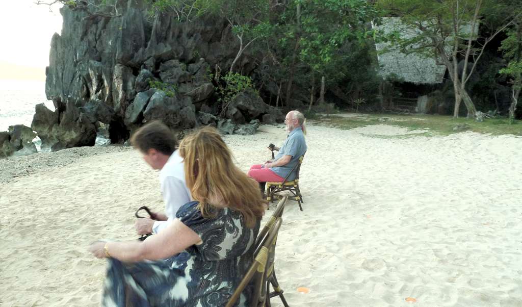 The family taking their seats (the Hidden Beach Villa can be seen in the background)
