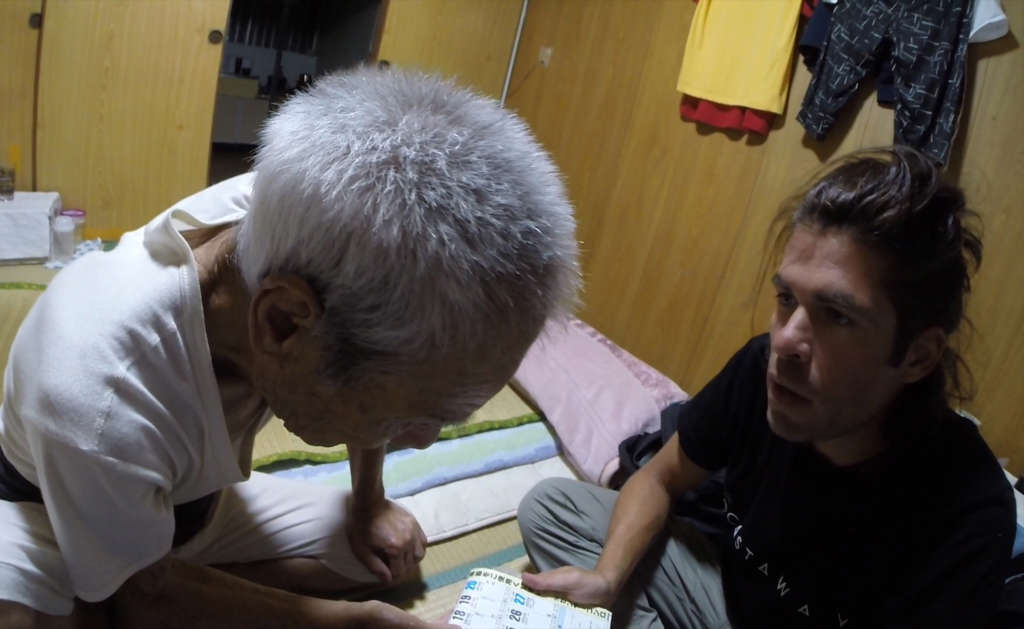Masafumi Nagasaki and Alvaro Cerezo from Docastaway talking in front of a calendar